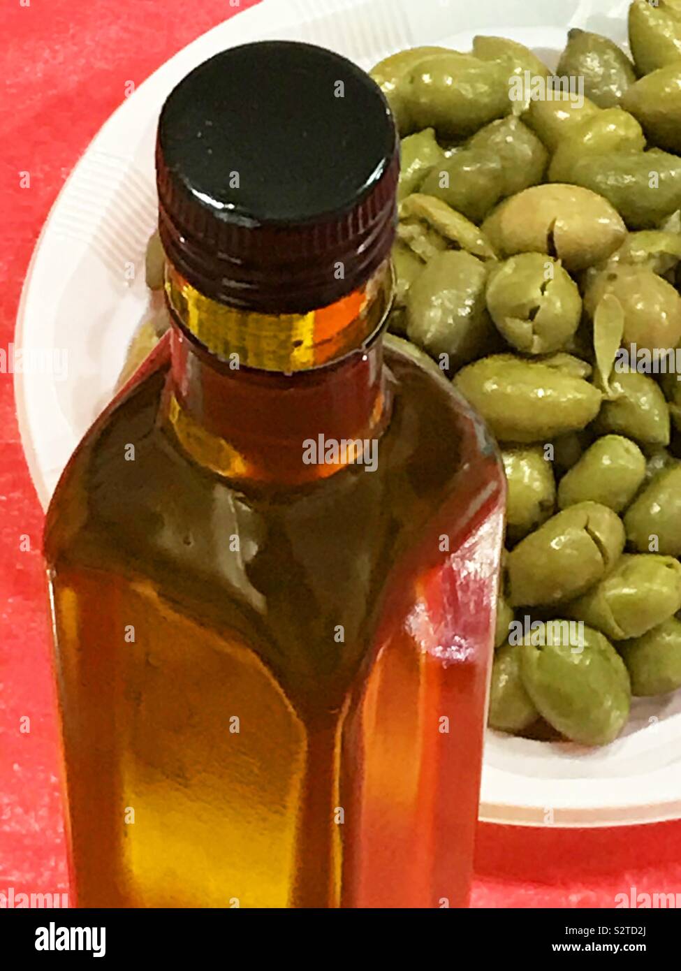 Olive oil and green olives. - Smartphone Captured Stock Image