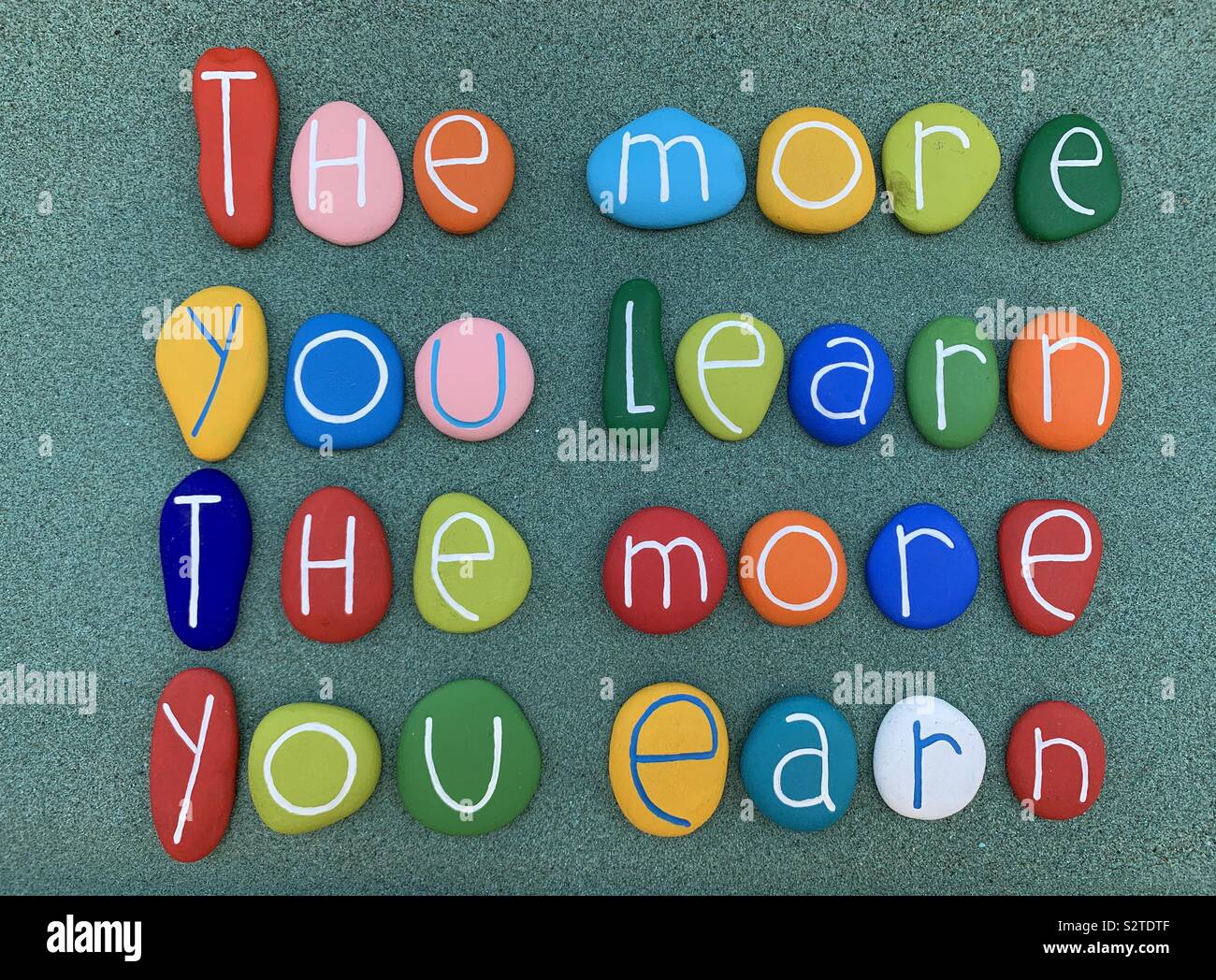 The more you earn, the more you earn - Smartphone Captured Stock Image