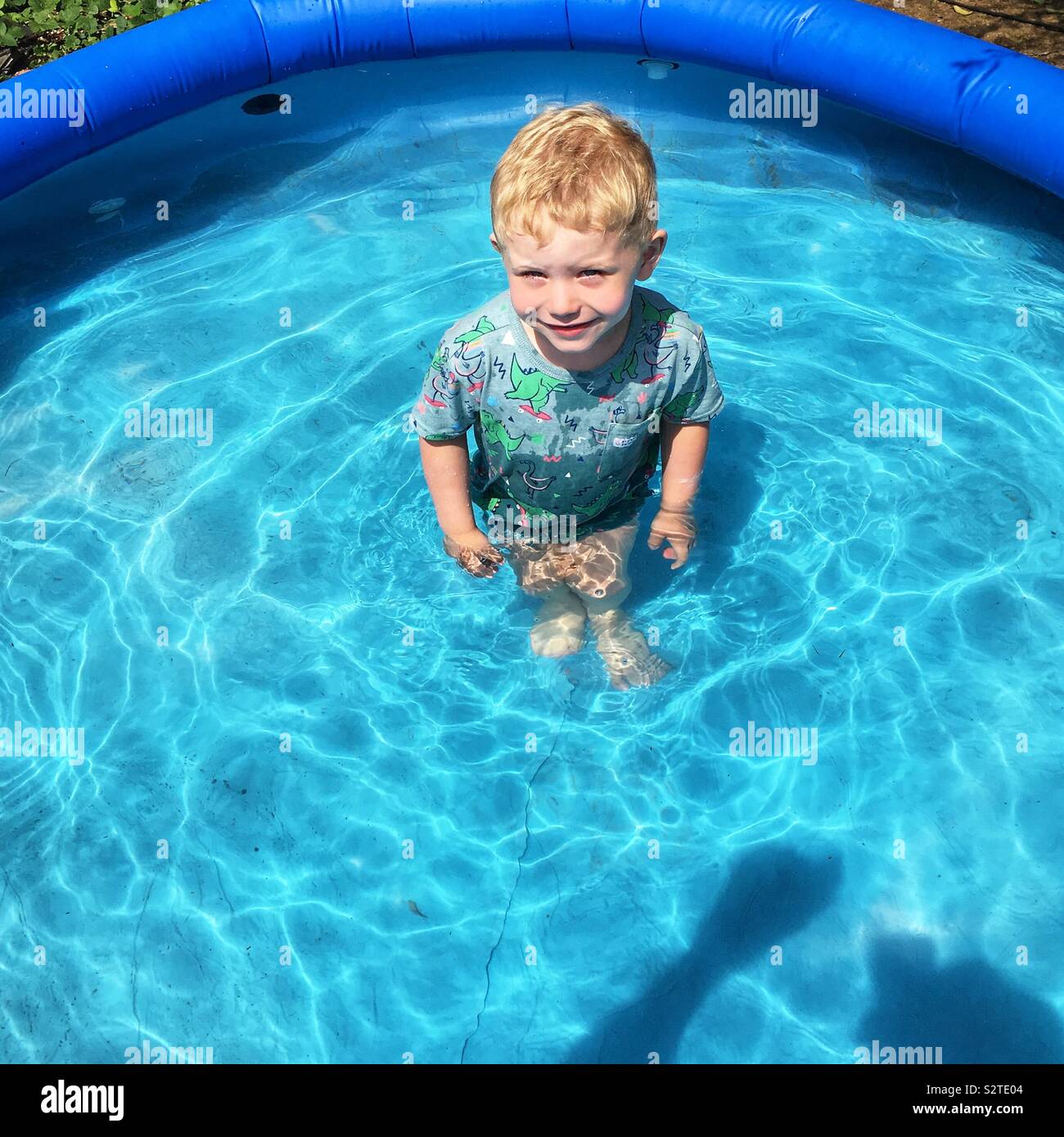 Two Year Old Boy In A Paddling Pool Stock Photo Alamy