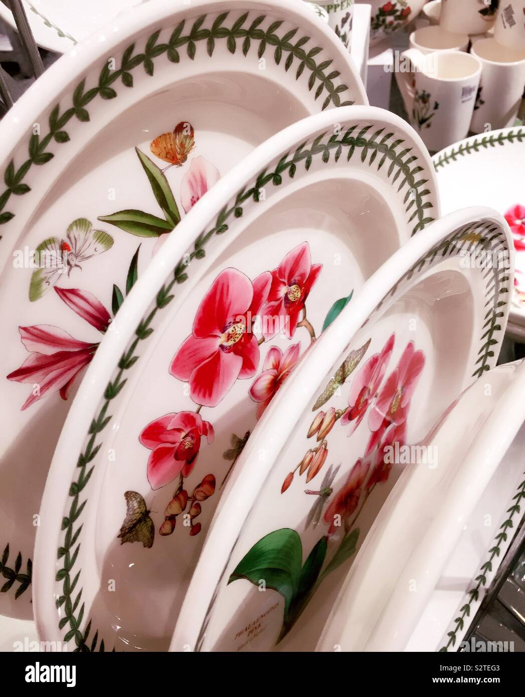 Display of china plates with flower pattern on sale in the New York City Department store, USA - Smartphone Captured Stock Image