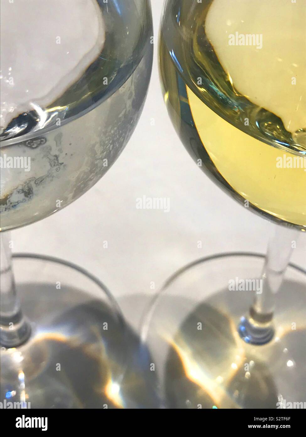Glass of water and glass of white wine. - Smartphone Captured Stock Image