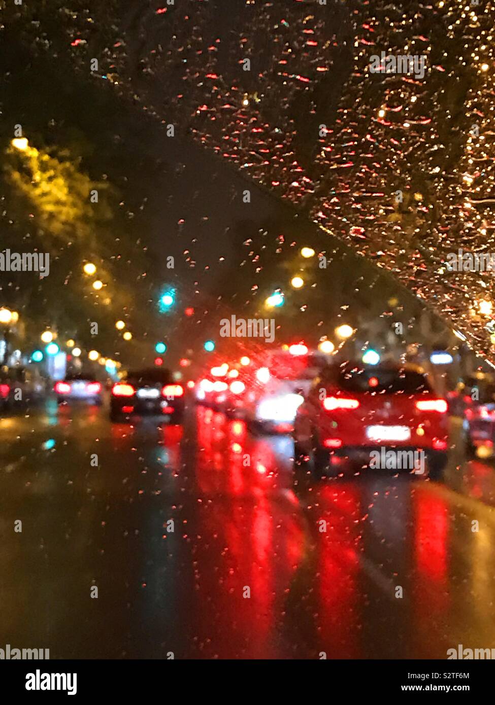 Urban traffic in rainy night. Stock Photo