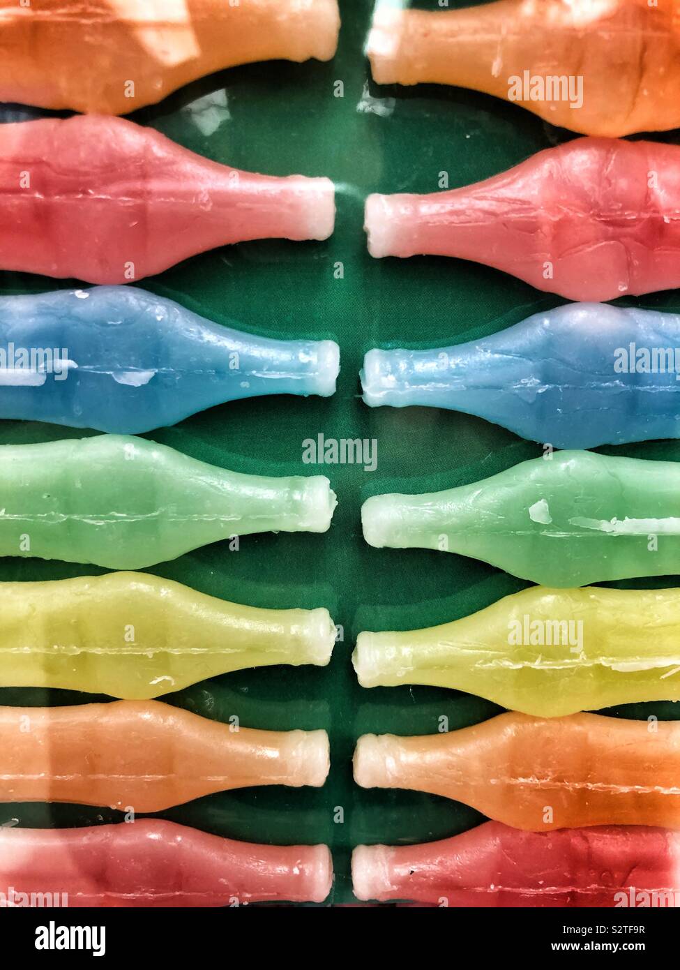 Colorful wax bottle candies aligned in rows - Smartphone Captured Stock Image