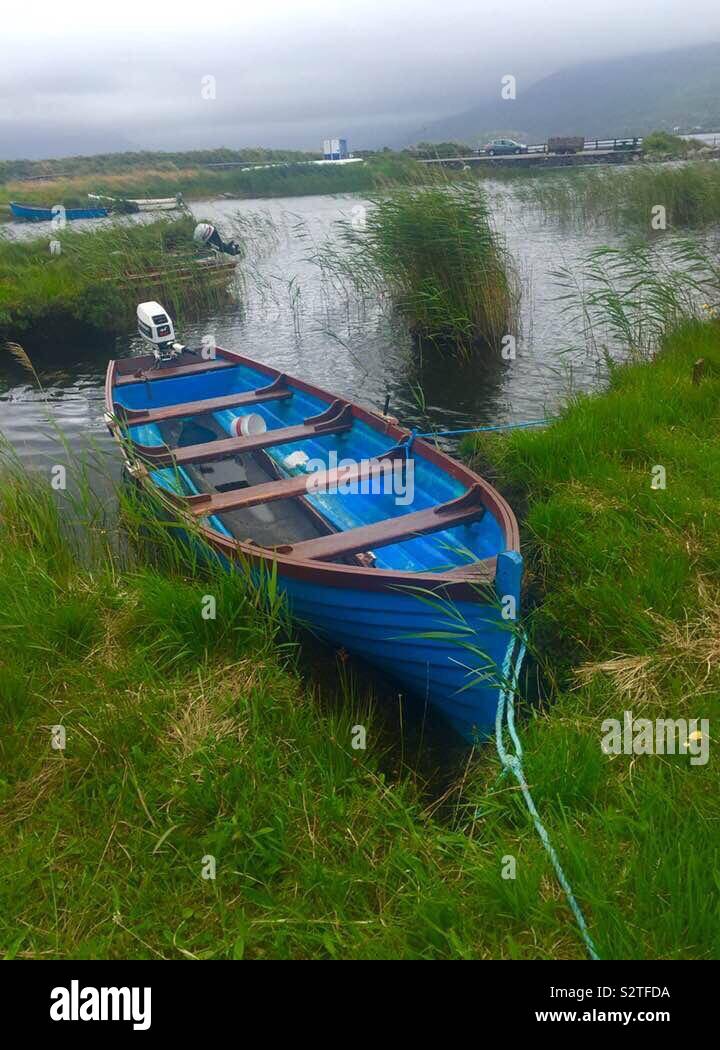 Blue, rowing, boat, Lough Currane, Waterville, Co Kerry, Ireland Stock