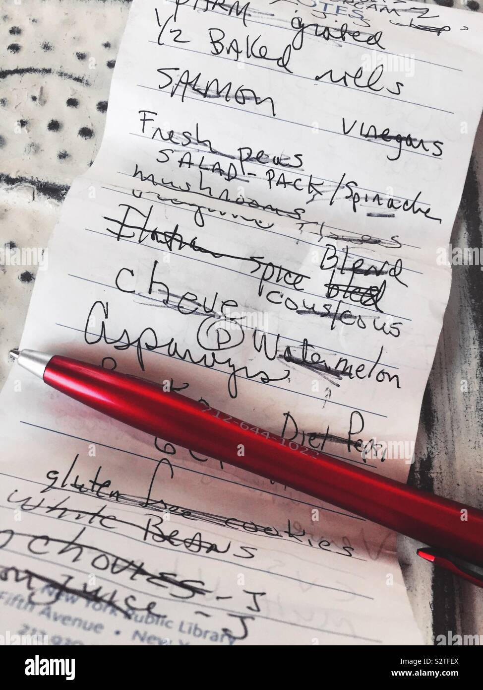 Grocery list and ball point pen close up, USA - Smartphone Captured Stock Image