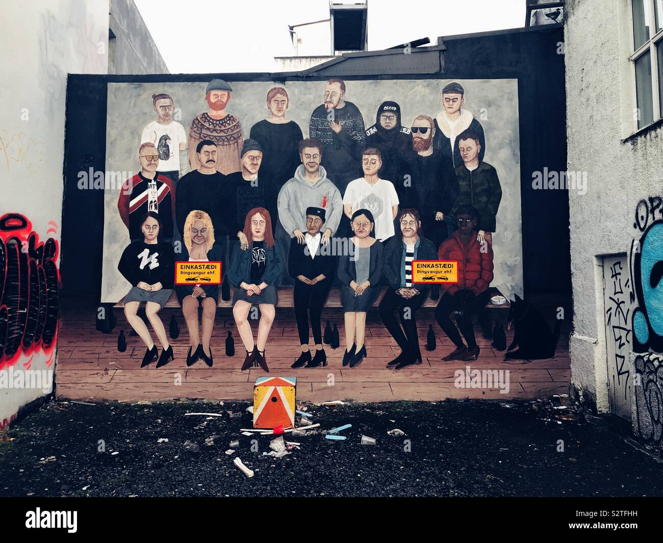 Creepy family portrait painted mural in Reykjavik - Smartphone Captured Stock Image
