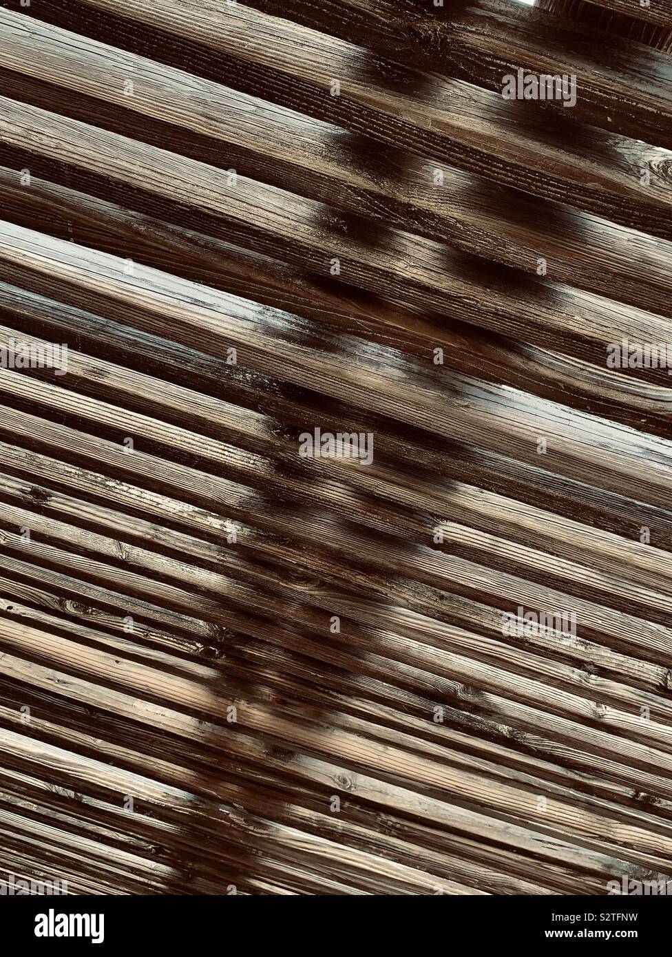 Abstract Of Outdoor Wooden Ceiling With Light Shining