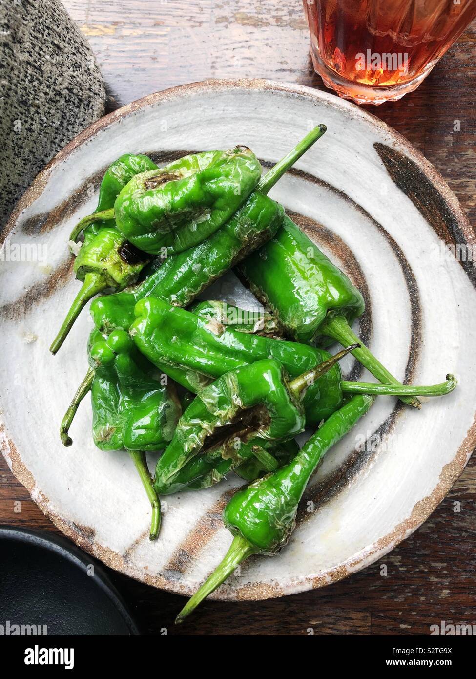 Blistered Shishito peppers with salt - Smartphone Captured Stock Image