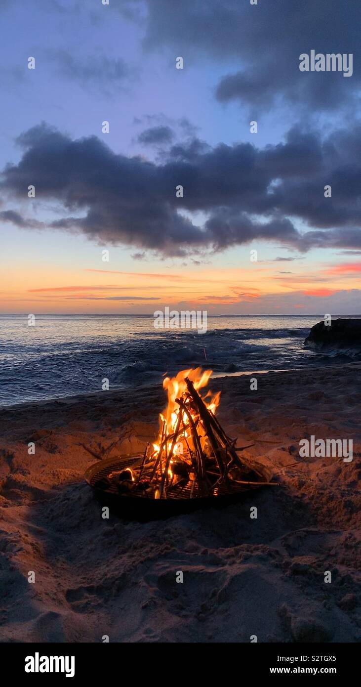 Beach bonfire at sunset - Smartphone Captured Stock Image