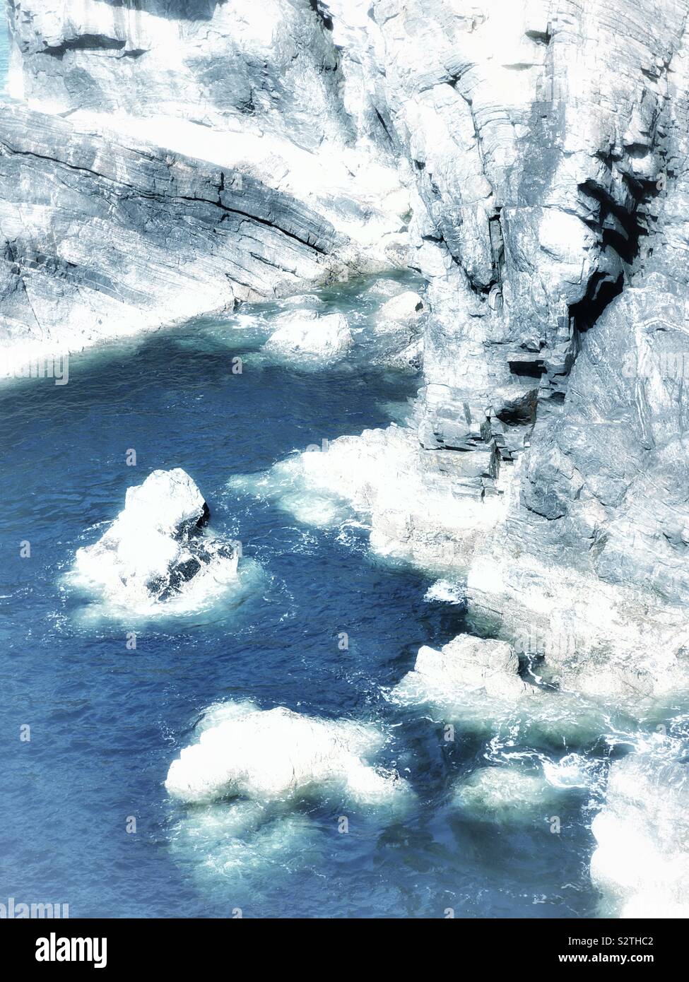 High angle shot of rugged cliffs and ocean - Smartphone Captured Stock Image