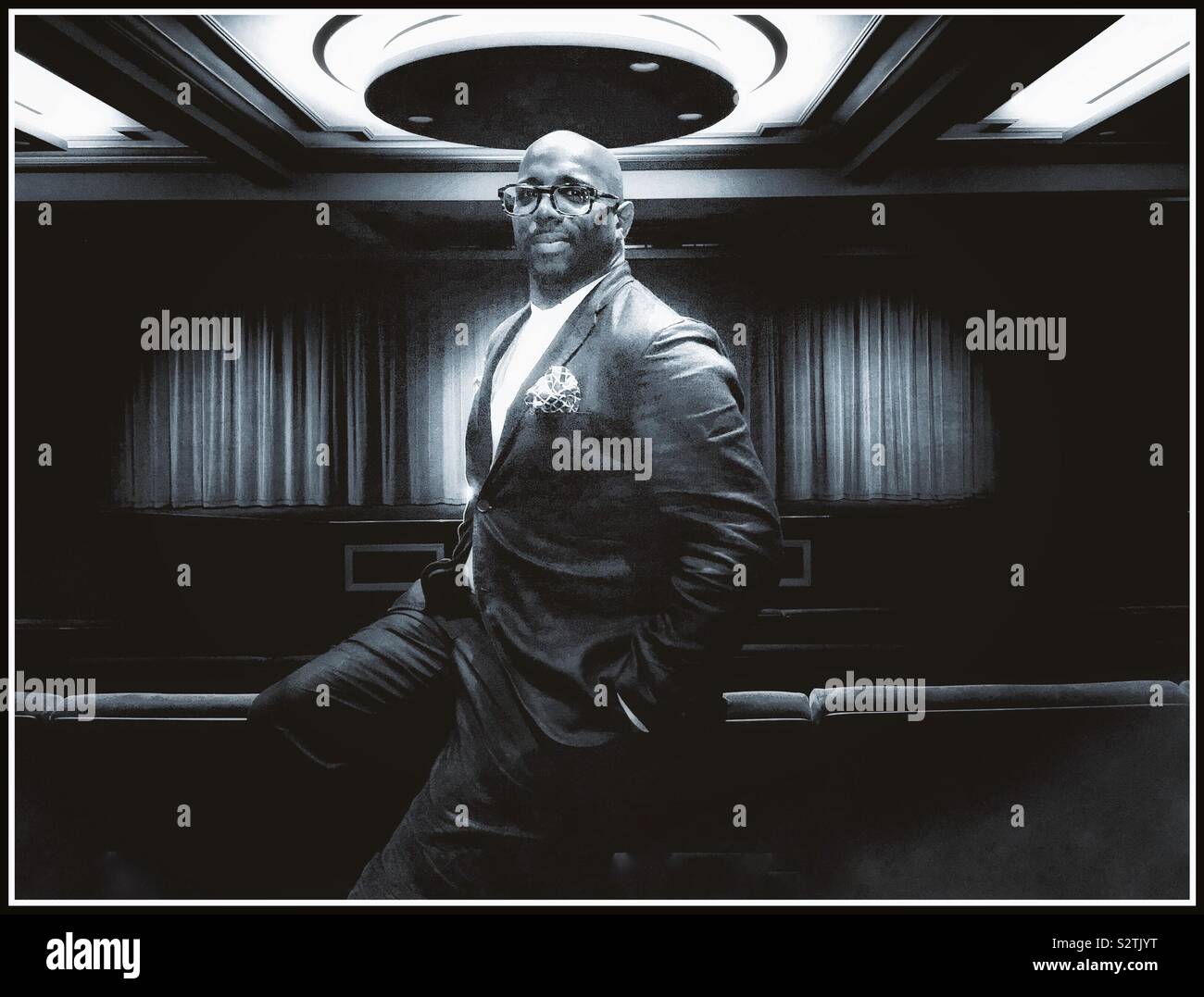 Portrait of a black male in screening room. - Smartphone Captured Stock Image