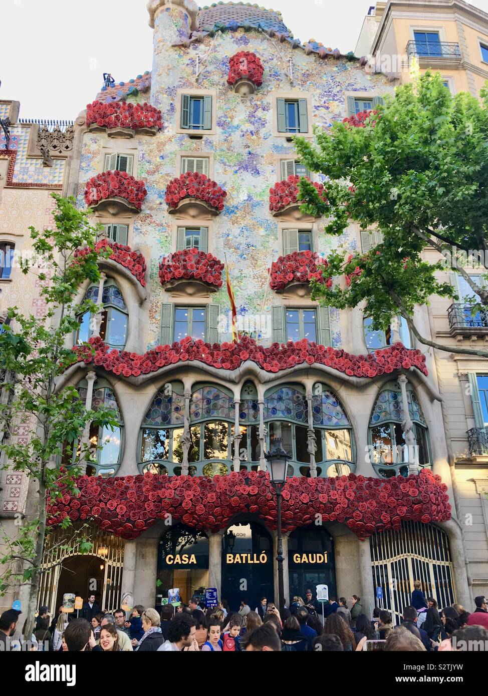 Anton Gaudi’s Casa Batllo decorated with red roses for Saint Jordi day Stock Photo