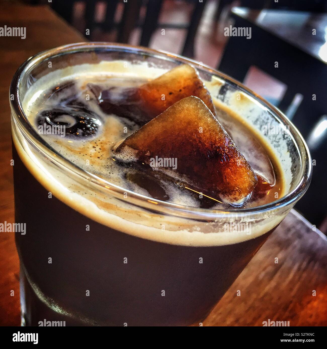 Iced coffee at Antipodean Café, a restaurant in Kuala Lumpur, Malaysia that buys its coffee beans directly from small-holding growers and roasts them in-house Stock Photo