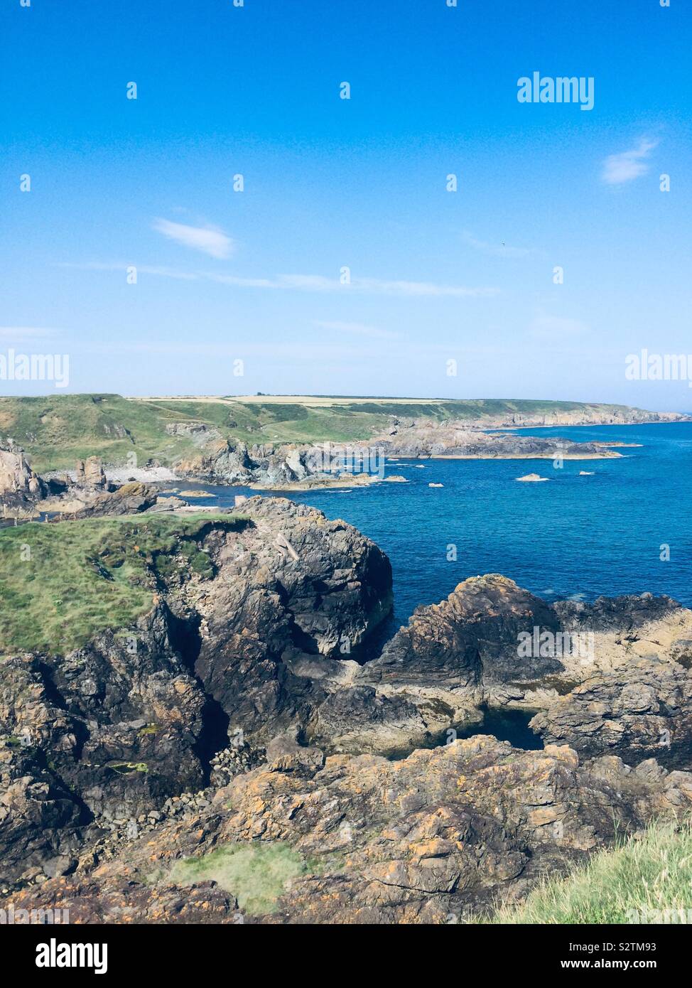 The beautiful rocky coastline of the east coast of Scotland Stock Photo ...