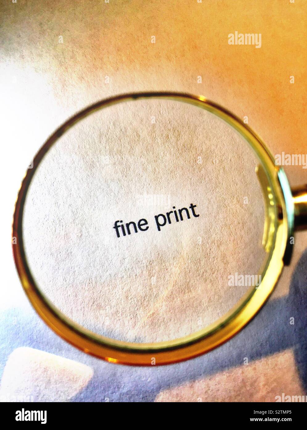 Fine print as seen by a magnifying glass, USA - Smartphone Captured Stock Image