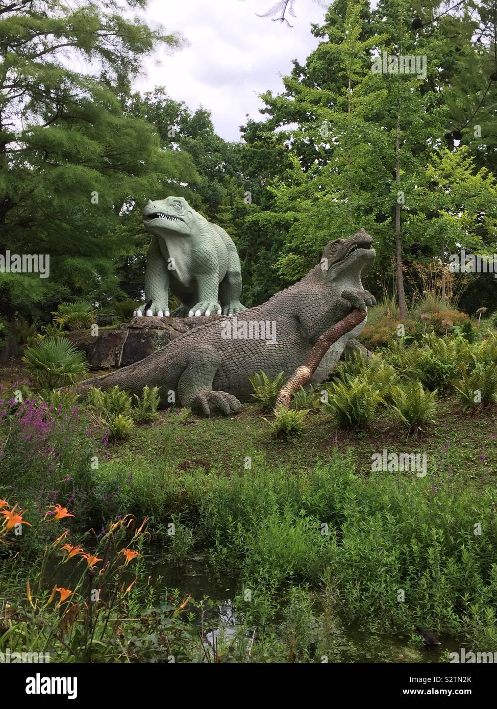 Iguanodon and megalosaurus Crystal Palace dinosaurs taken in August 2019 - Smartphone Captured Stock Image
