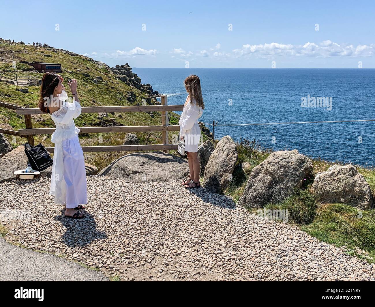Two women at Land’s End in Cornwall - Smartphone Captured Stock Image