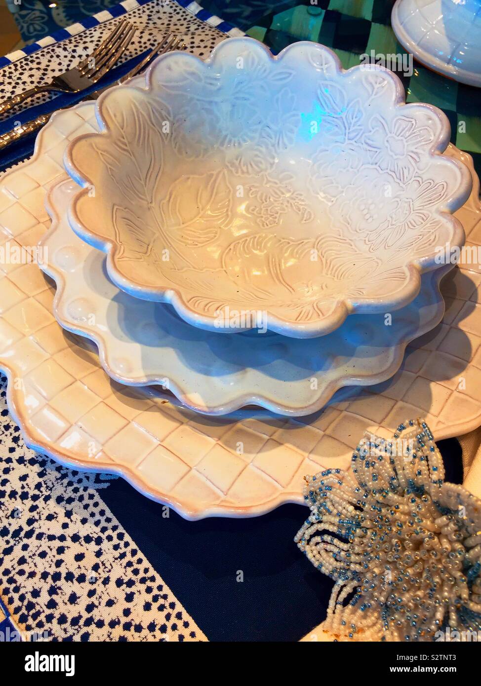 Plates end table setting display in a department store, New York City - Smartphone Captured Stock Image