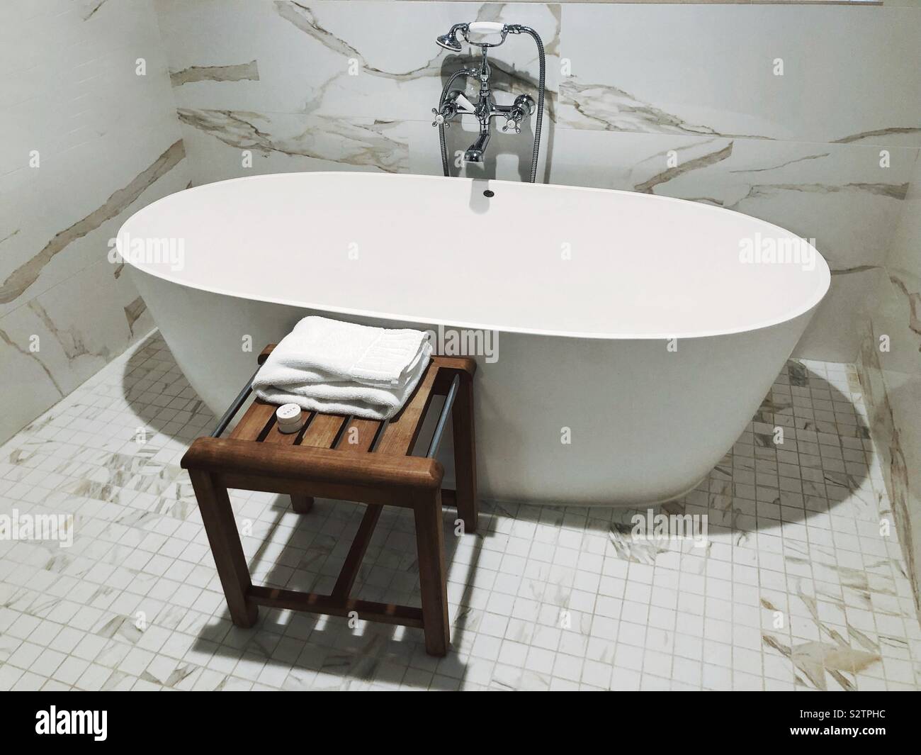 A large soaking bathtub in an elegant spa-like setting - Smartphone Captured Stock Image