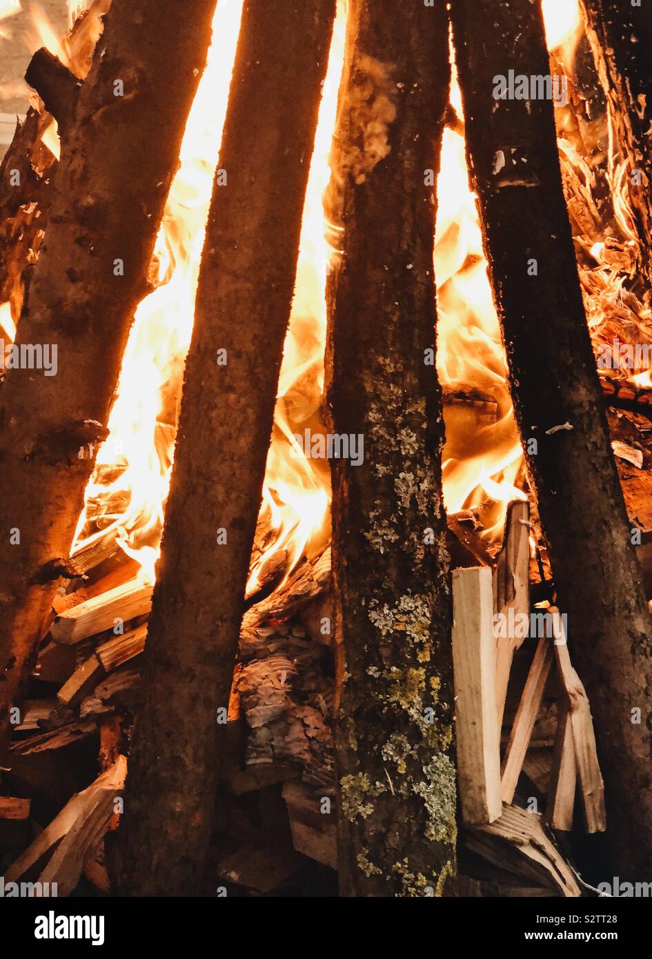 Burning logs in a camp fire pit - Smartphone Captured Stock Image