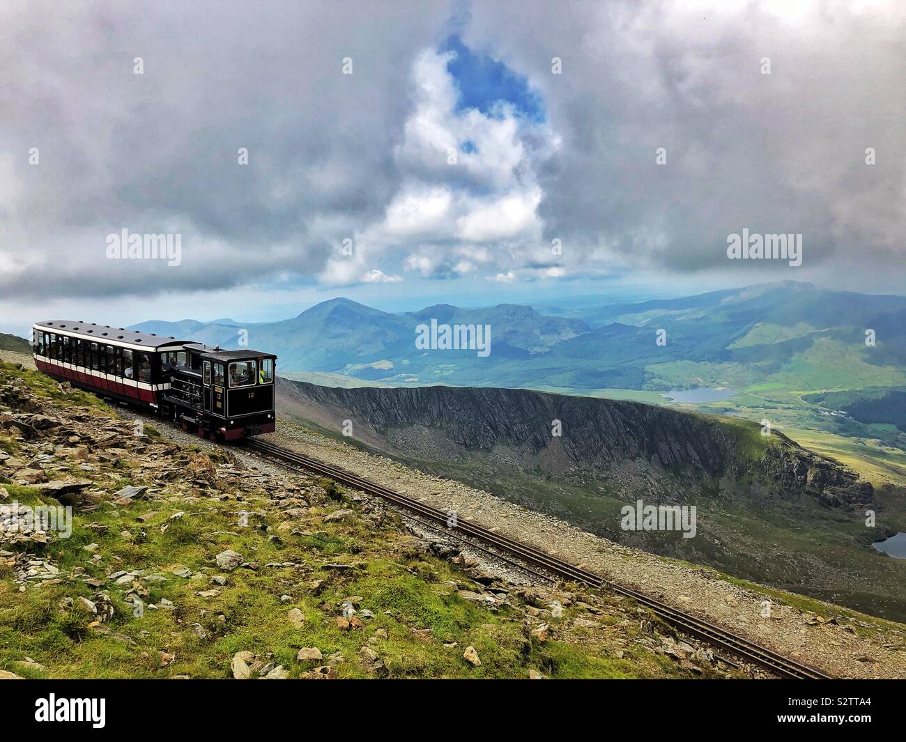 Snowdon mountain railway with the descending train, just leaving the peak, August. - Smartphone Captured Stock Image