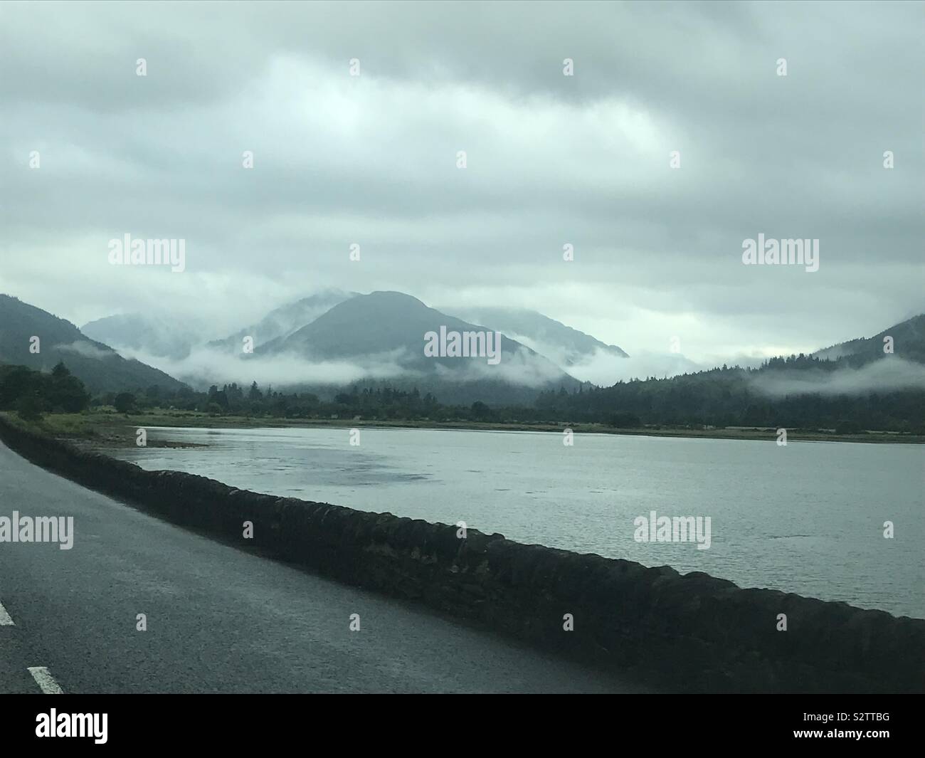 Photo of the loch with the hills and clouds at Arrochar Stock Photo