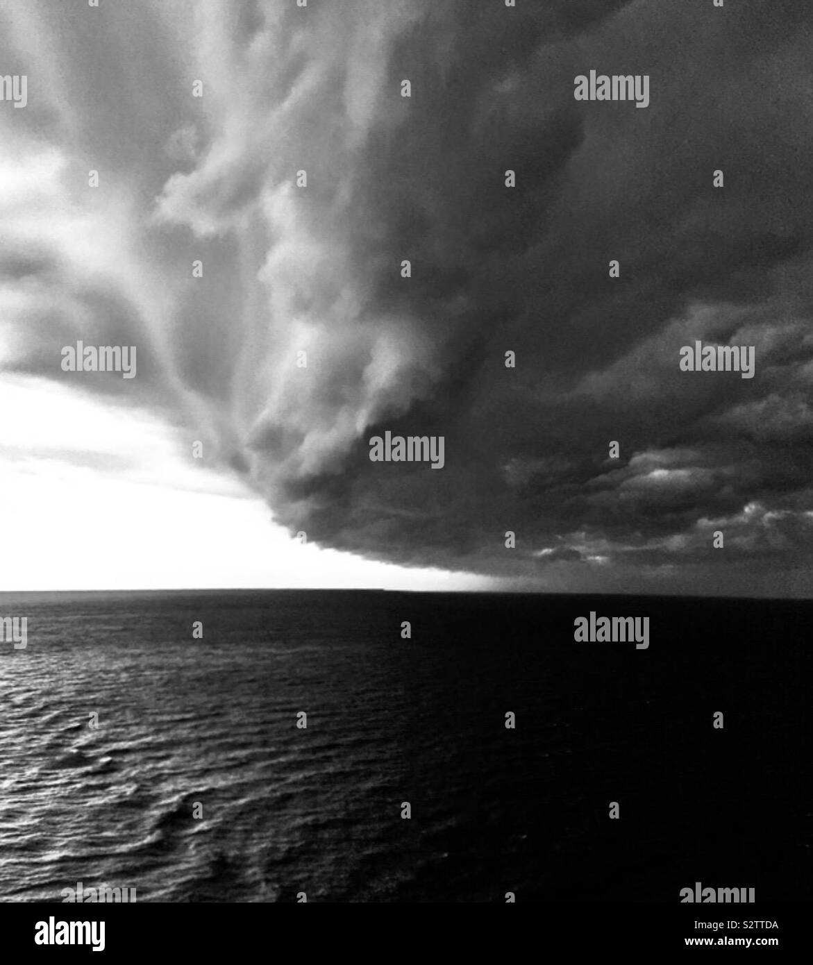 Storming rolling in over the Atlantic Ocean - black and white version Stock Photo