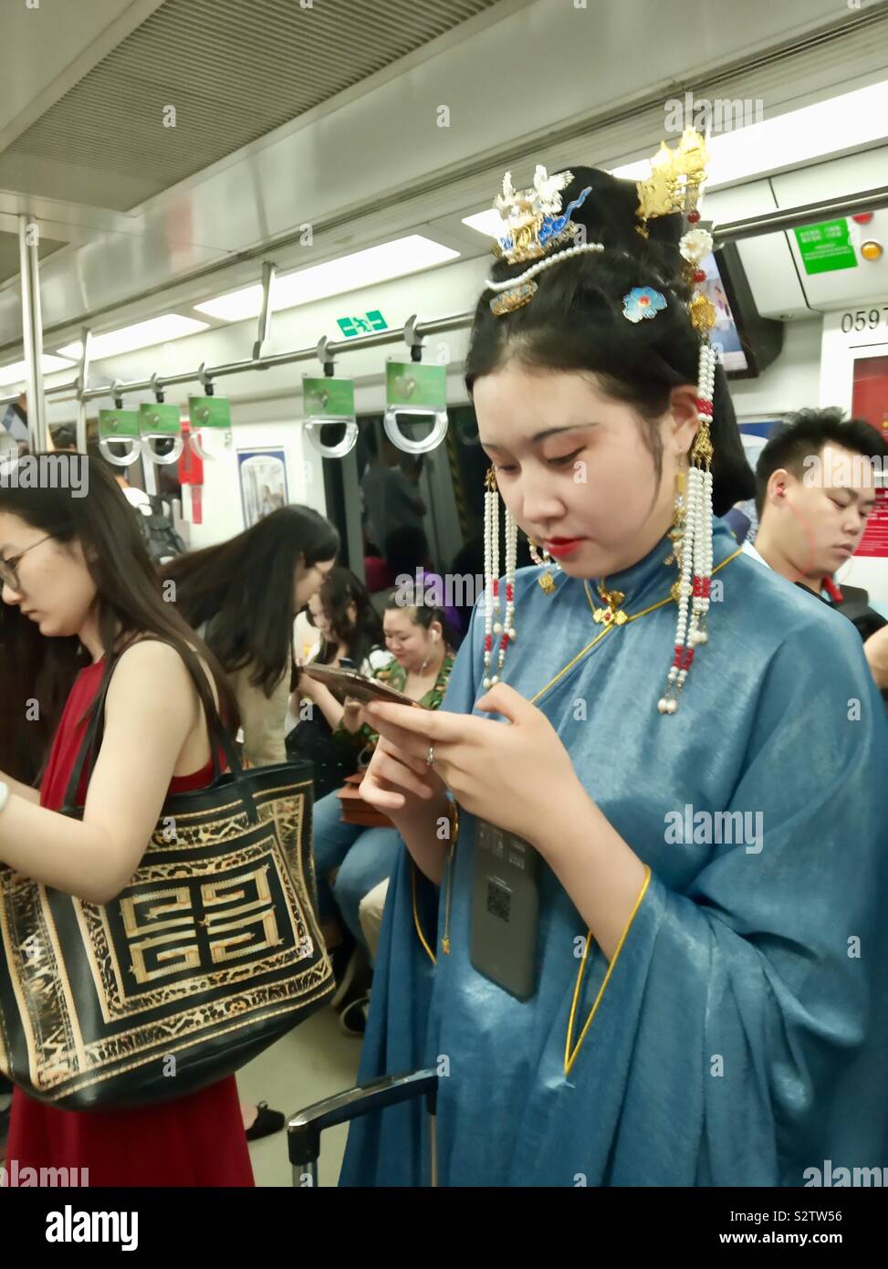 Riding in the Beijing metro. - Smartphone Captured Stock Image