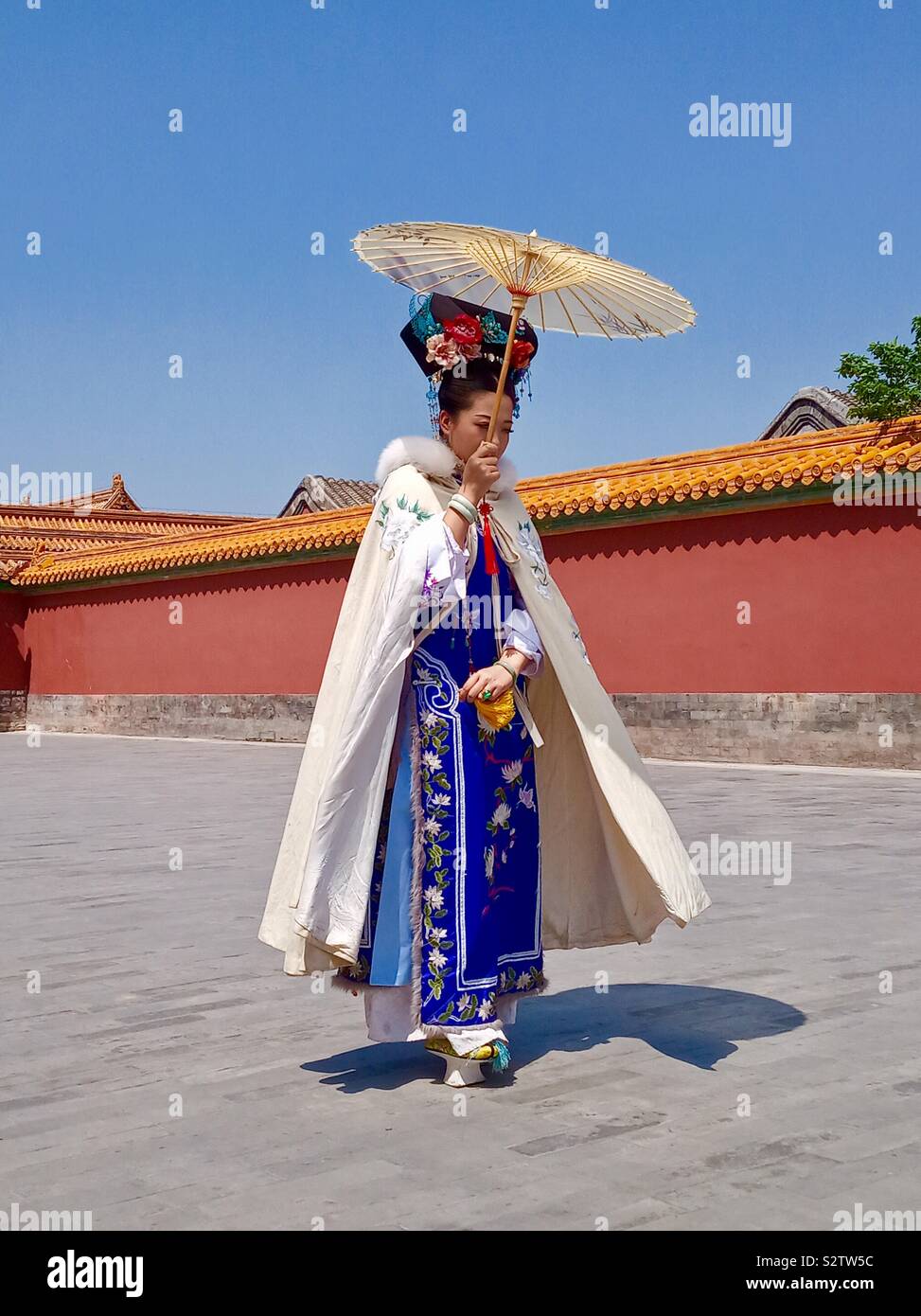 A traditionally dressed Chinese woman at the Forbidden city in Beijing. - Smartphone Captured Stock Image