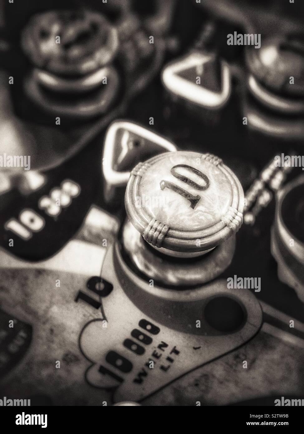 Vintage arcade game in sepia tone - Smartphone Captured Stock Image