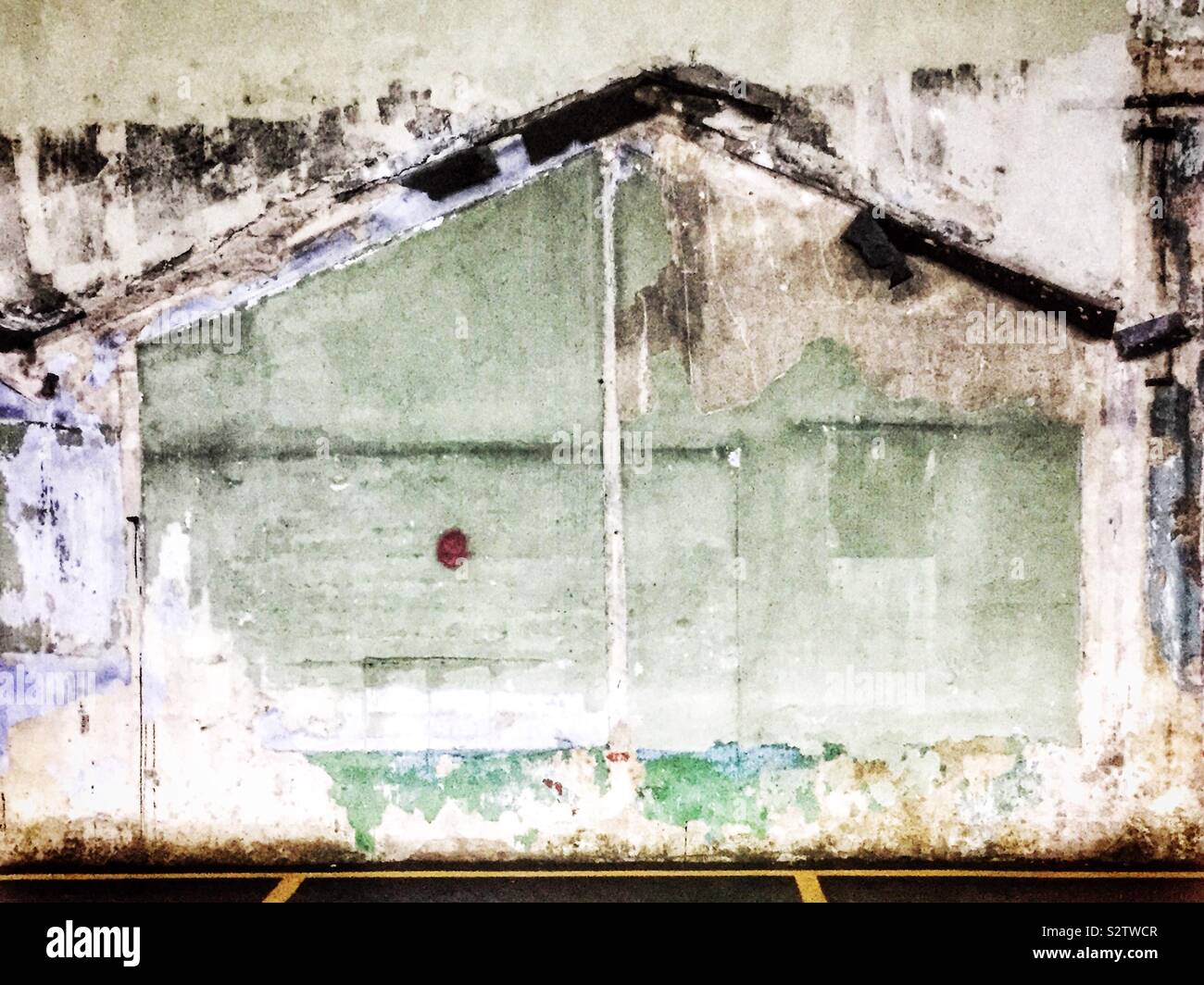 Outlines of houses and rooms remaining on the wall of a factory building after demolition, George Town, Penang, Malaysia - Smartphone Captured Stock Image