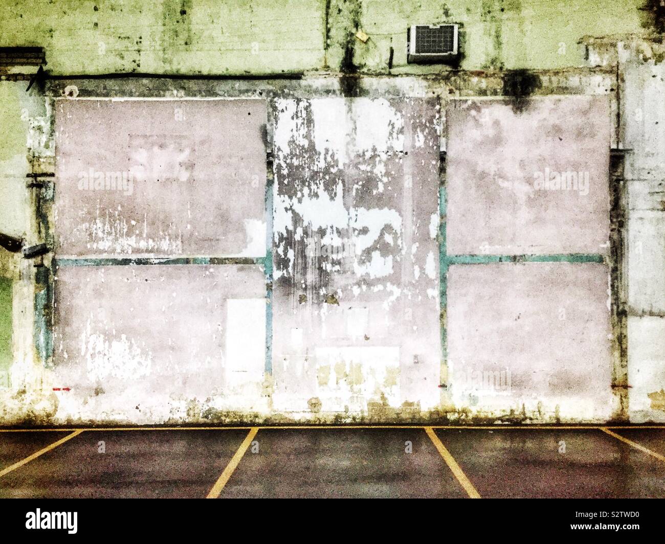 Outlines of houses and rooms remaining on the wall of a factory building after demolition, George Town, Penang, Malaysia - Smartphone Captured Stock Image