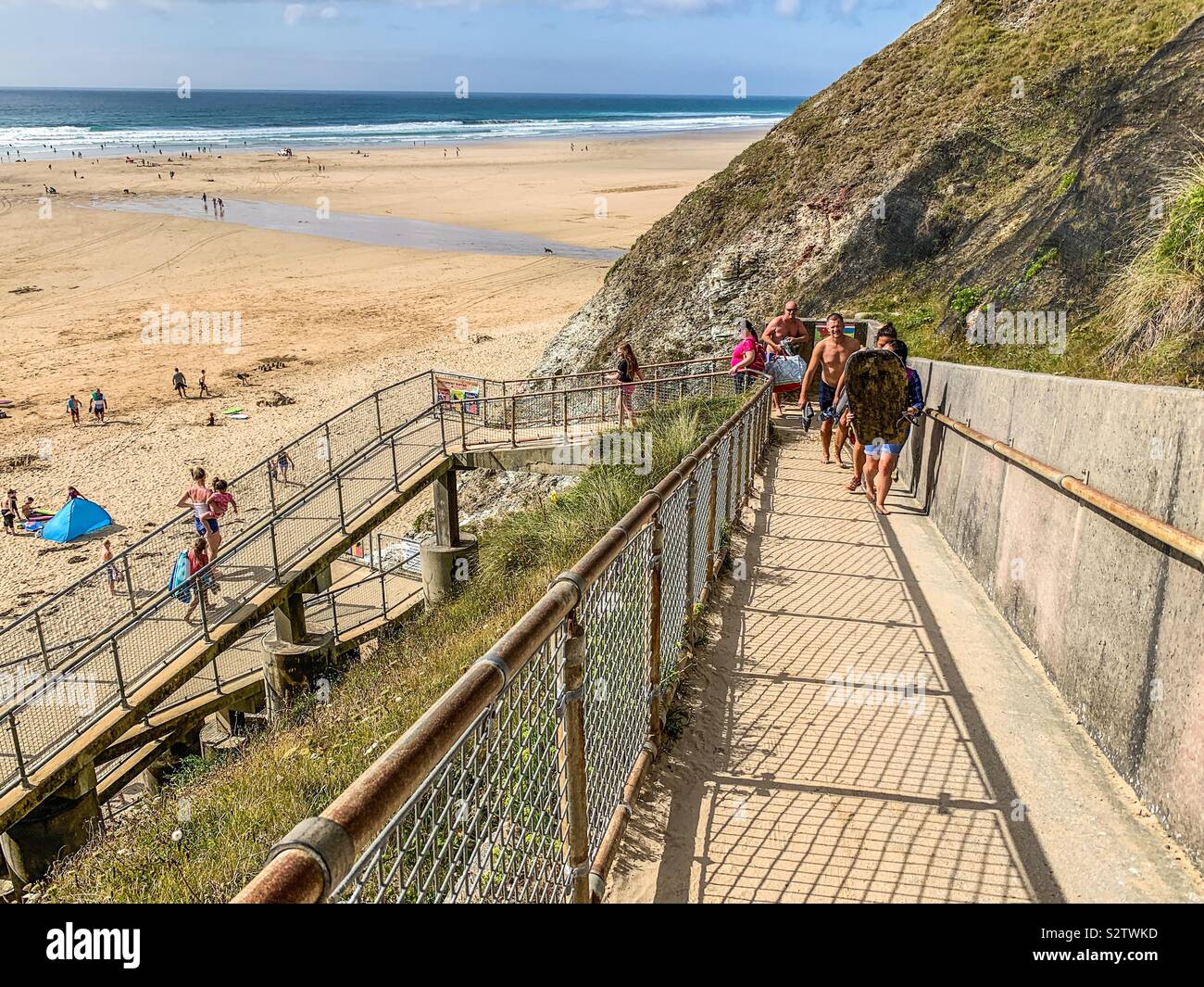 Very steep steps down to Perranporth beach in Cornwall Stock Photo