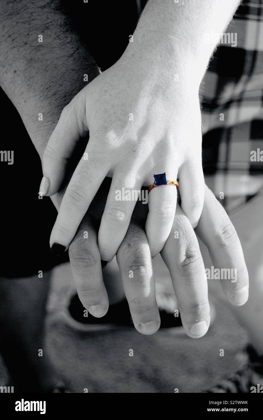 Engagement ring couple holding hands Stock Photo