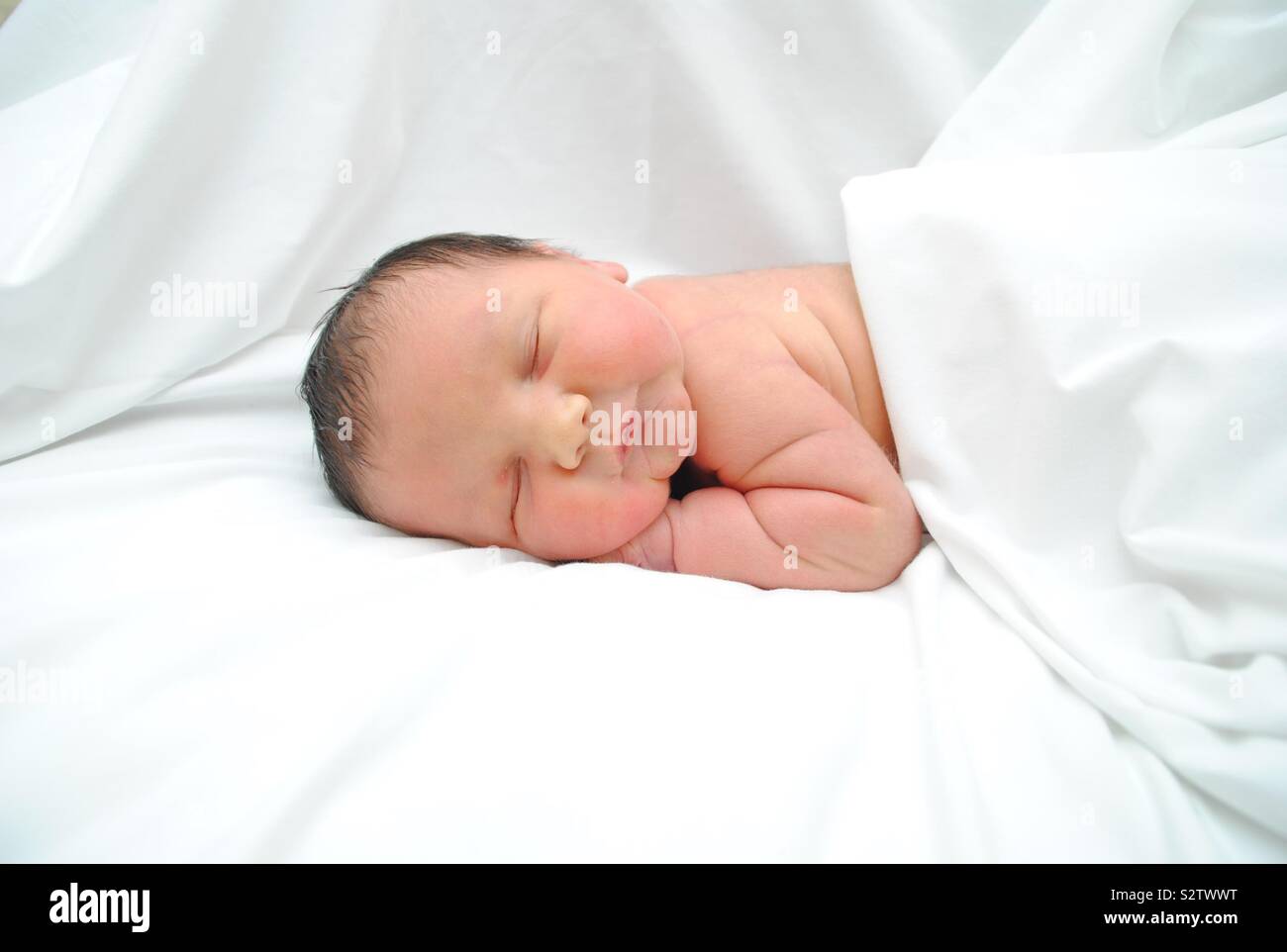 Sleeping newborn baby Stock Photo