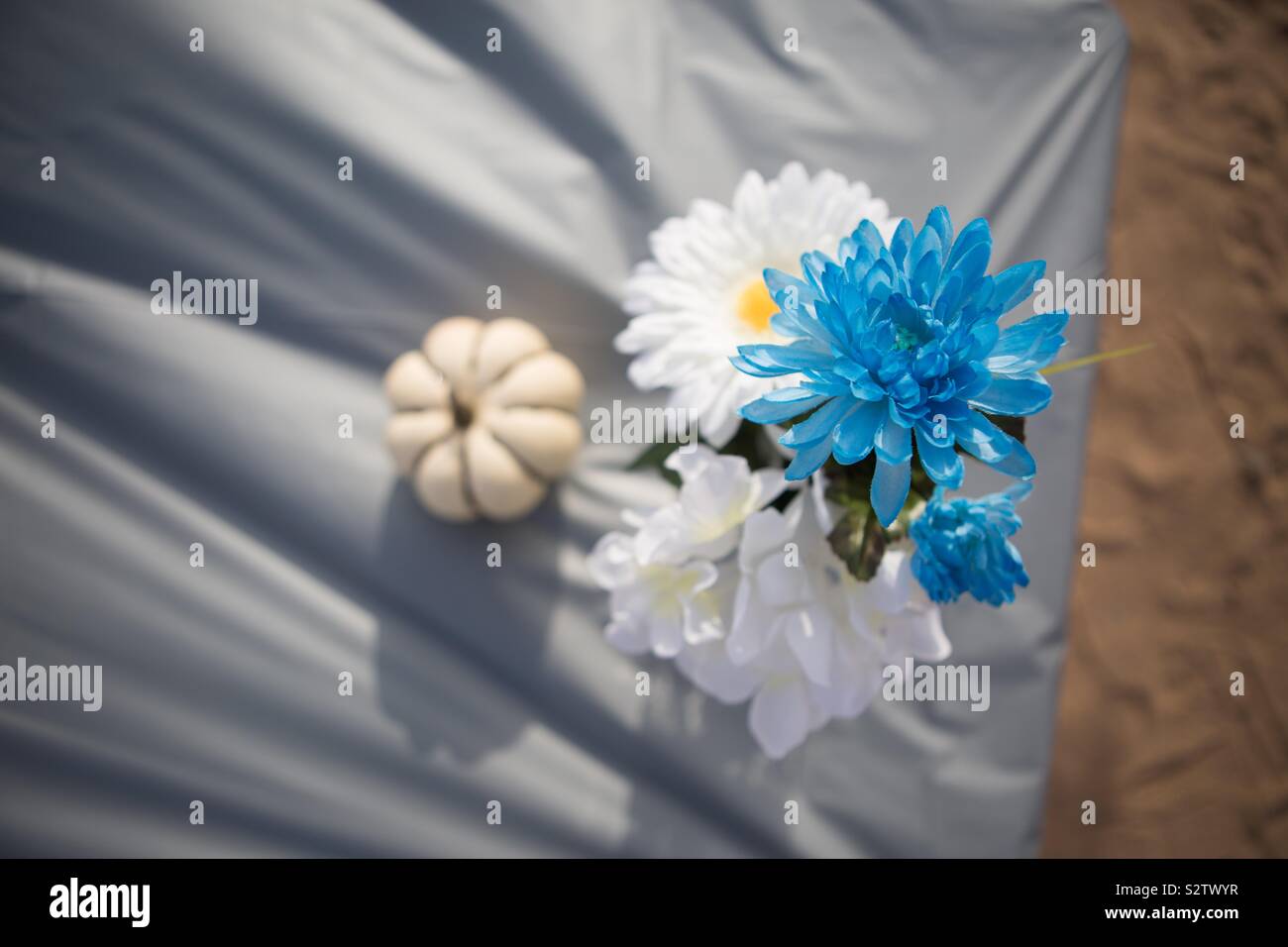 Flowers on table with pumpkin Stock Photo