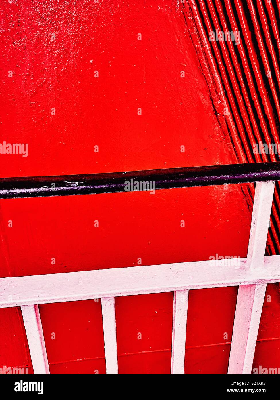 Red ships funnel detail and black and white railing abstract - Smartphone Captured Stock Image