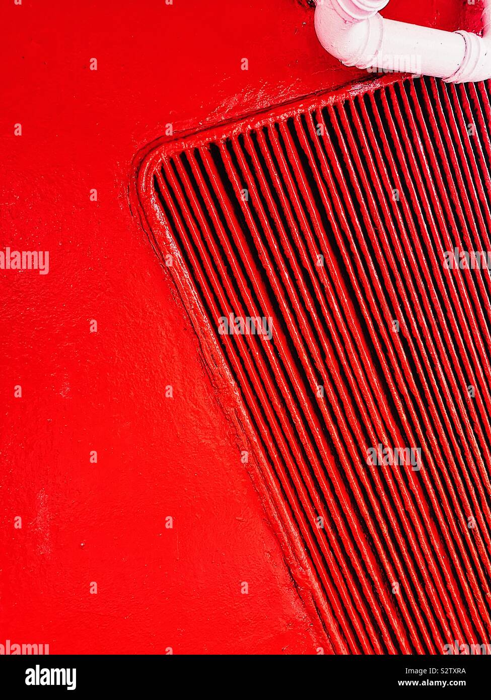 Abstract red ships funnel and white pipe close up - Smartphone Captured Stock Image