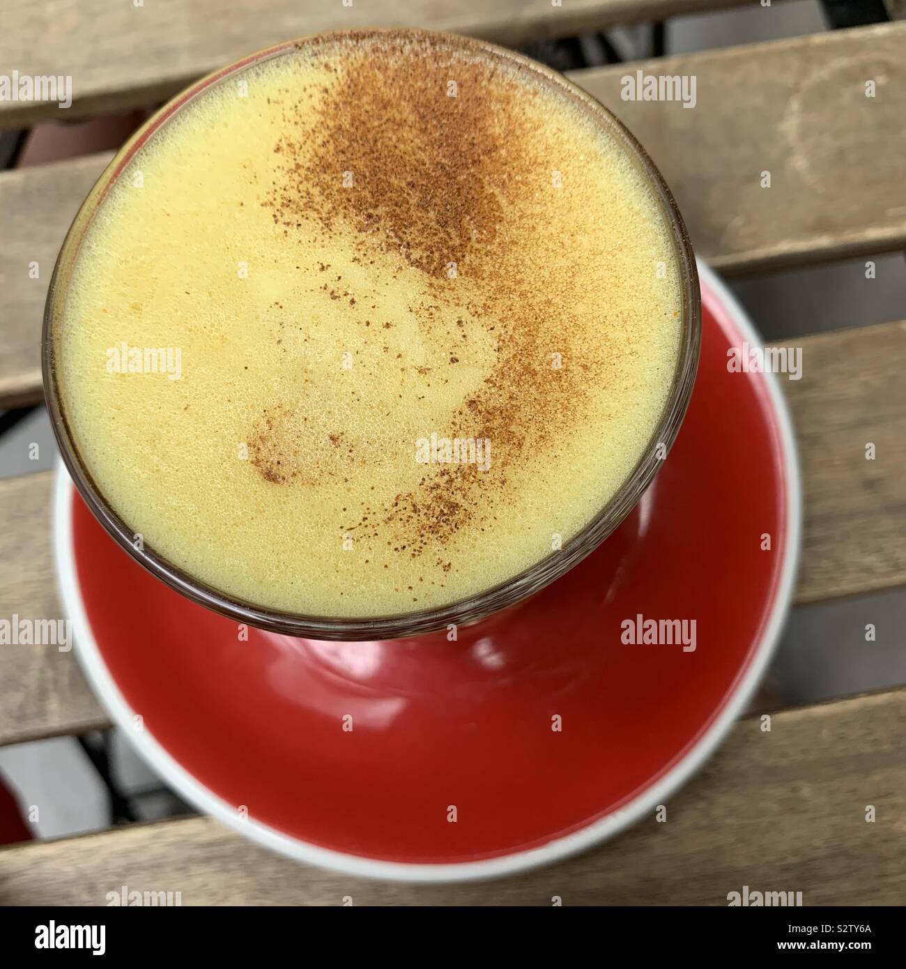 Turmeric latte with plant based oat milk. Alternative coffee culture