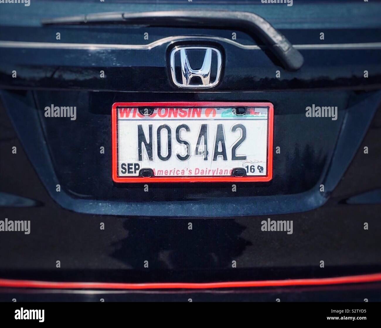 Vanity license plate NOS4A2 aka Nosferatu on black car with red trim vampire car based on bestselling horror novel by Joe Hill - Smartphone Captured Stock Image