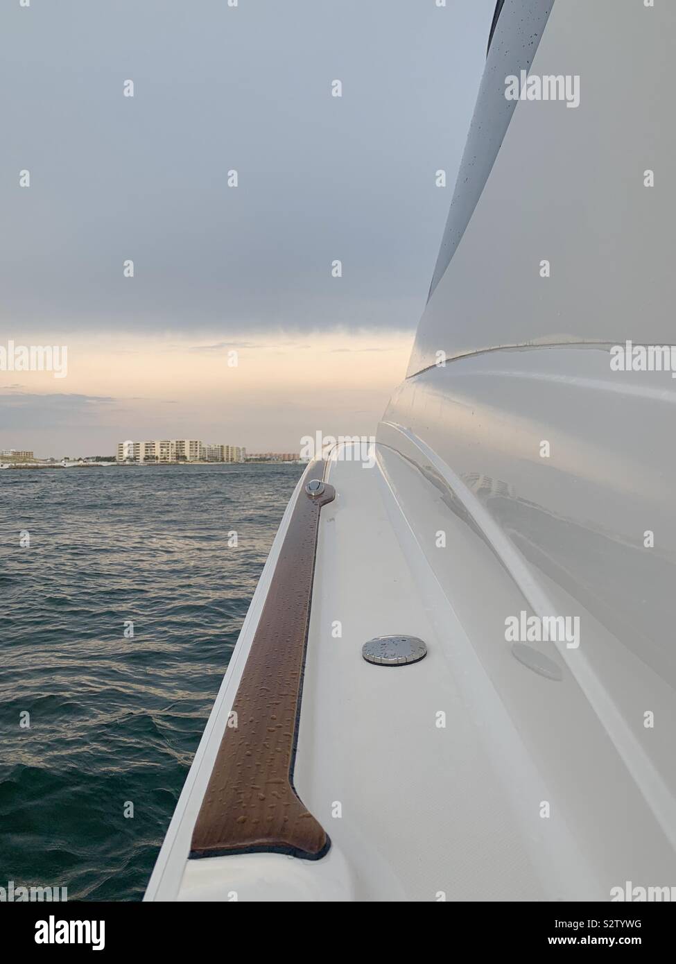 View of harbor looking from the side of my boat at beginning of sunset - Smartphone Captured Stock Image