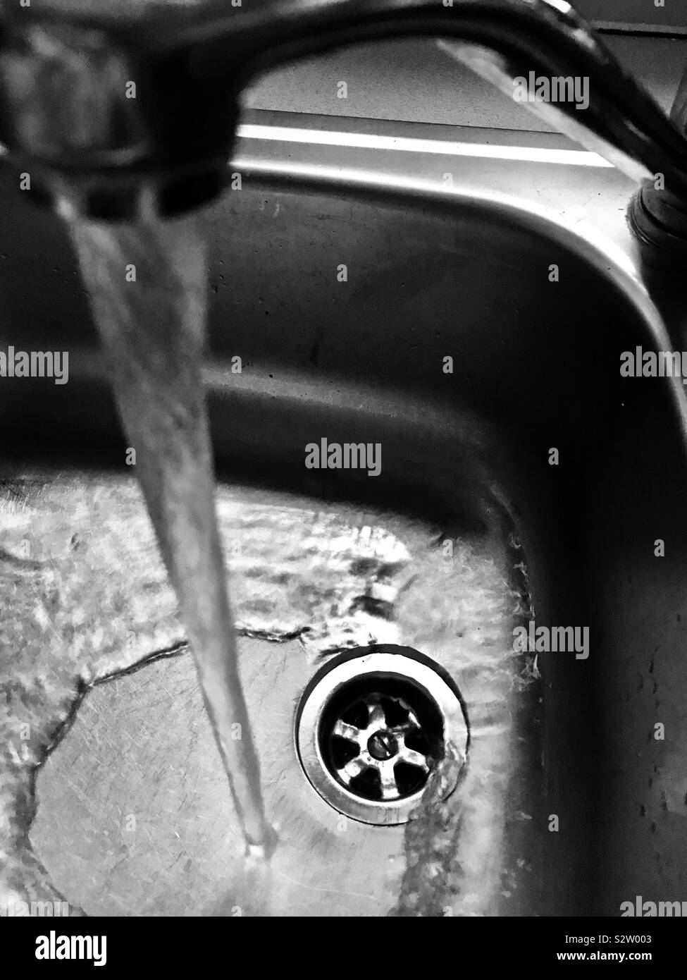 Down the plug hole Stock Photo Alamy
