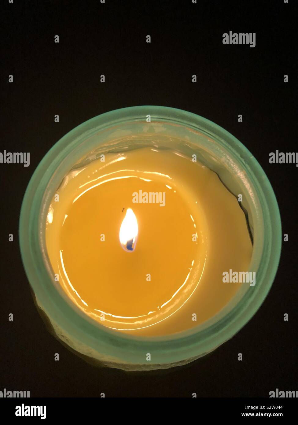 Yellow Candle burning Stock Photo Alamy
