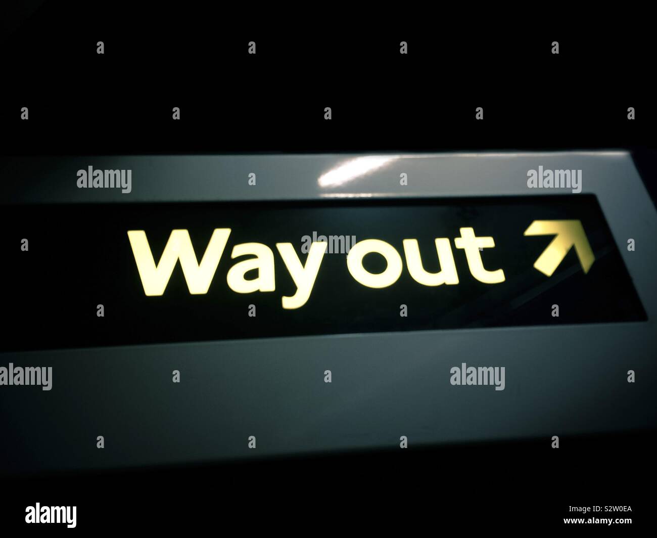 Way Out symbol from a subway in London, UK Stock Photo