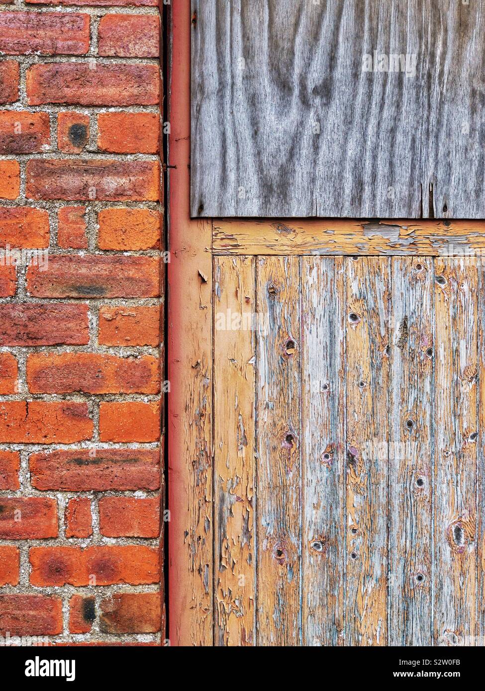 Old wooden door in a red brick wall Stock Photo - Alamy