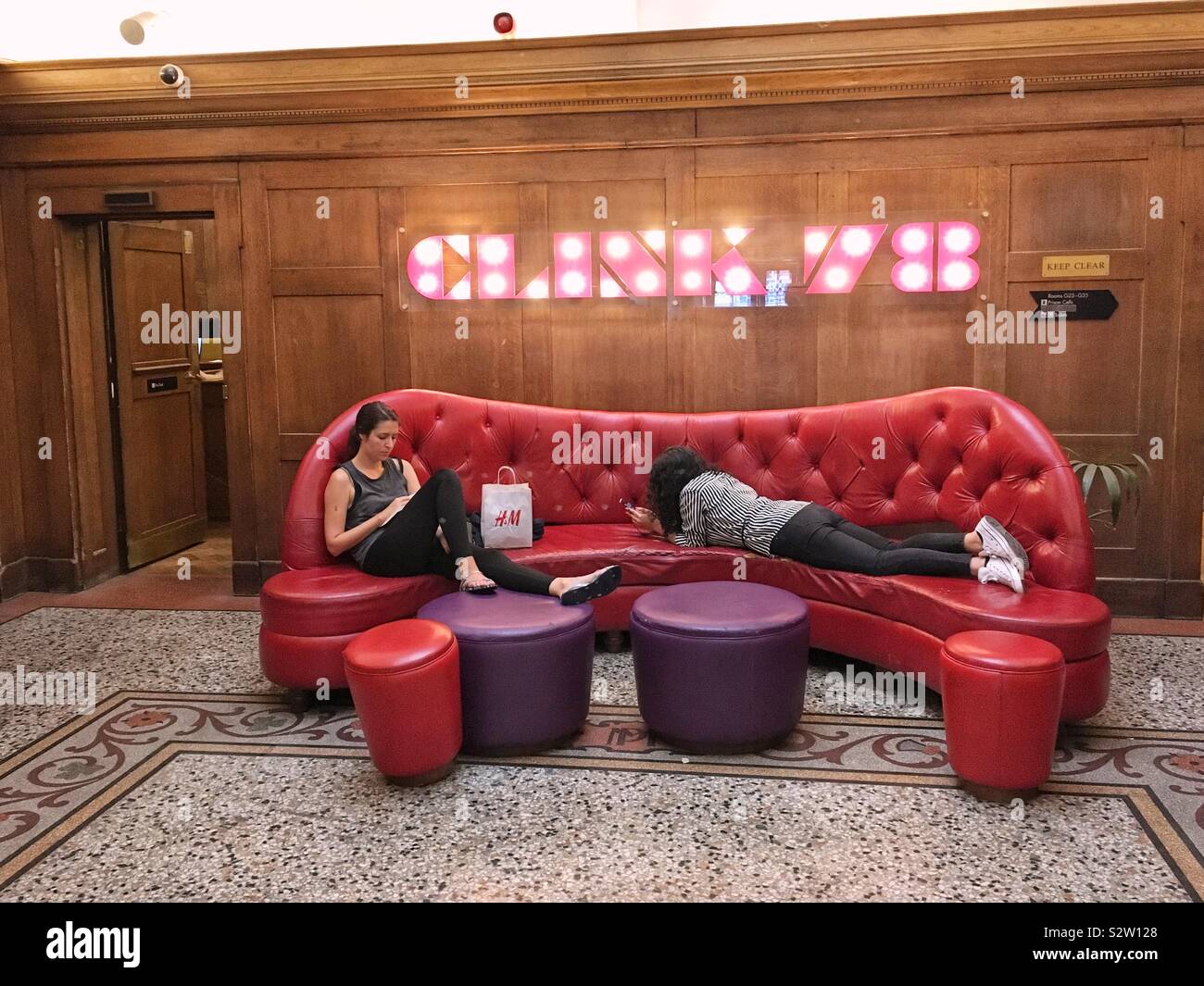 Reception area at The Clink78 hostel, Kings Cross, London, England, United Kingdom. - Smartphone Captured Stock Image