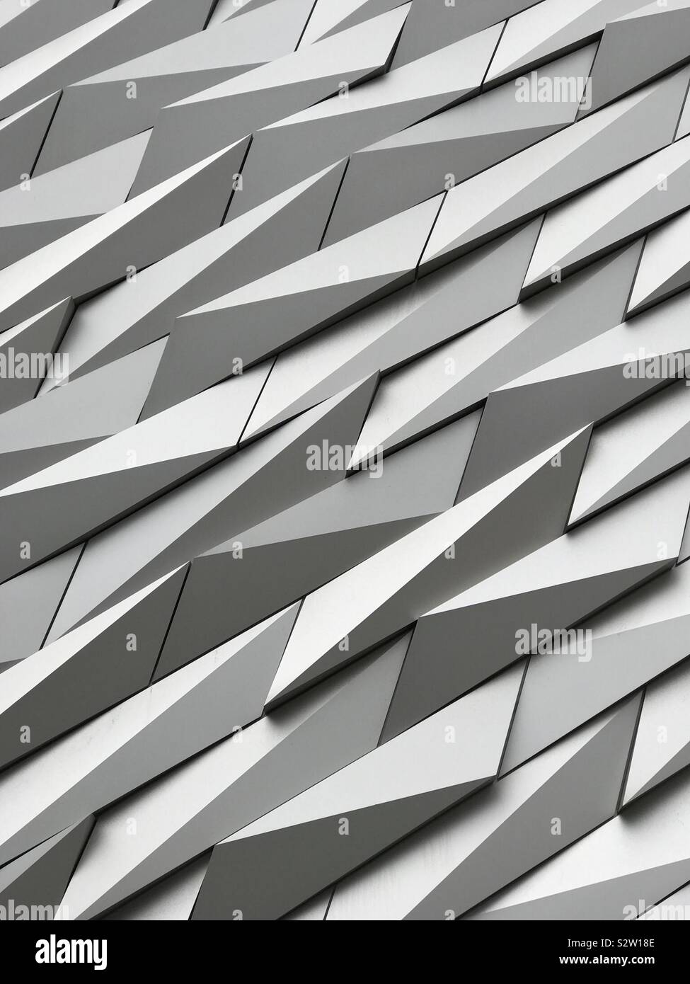 Belfast, Northern Ireland - June 6, 2019: The Titanic Museum metal exterior is shown in an external, closeup view. The building facade is composed of 3,000 anodized aluminum shards. - Smartphone Captured Stock Image
