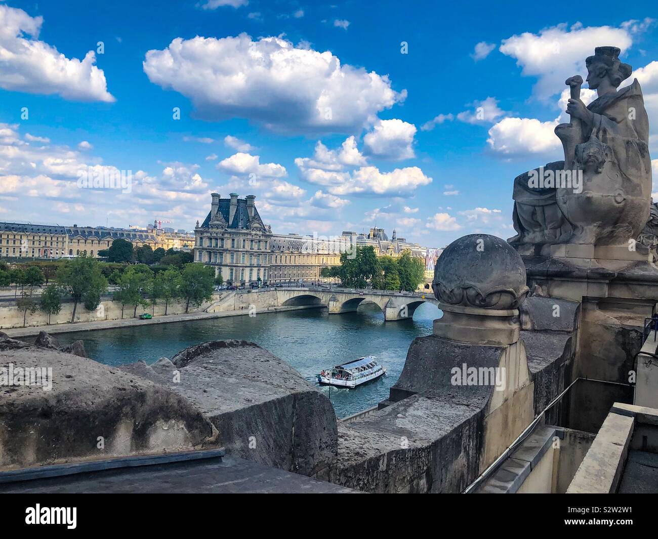 A view of The Louvre Museum and the Seine River from top of the Musee D