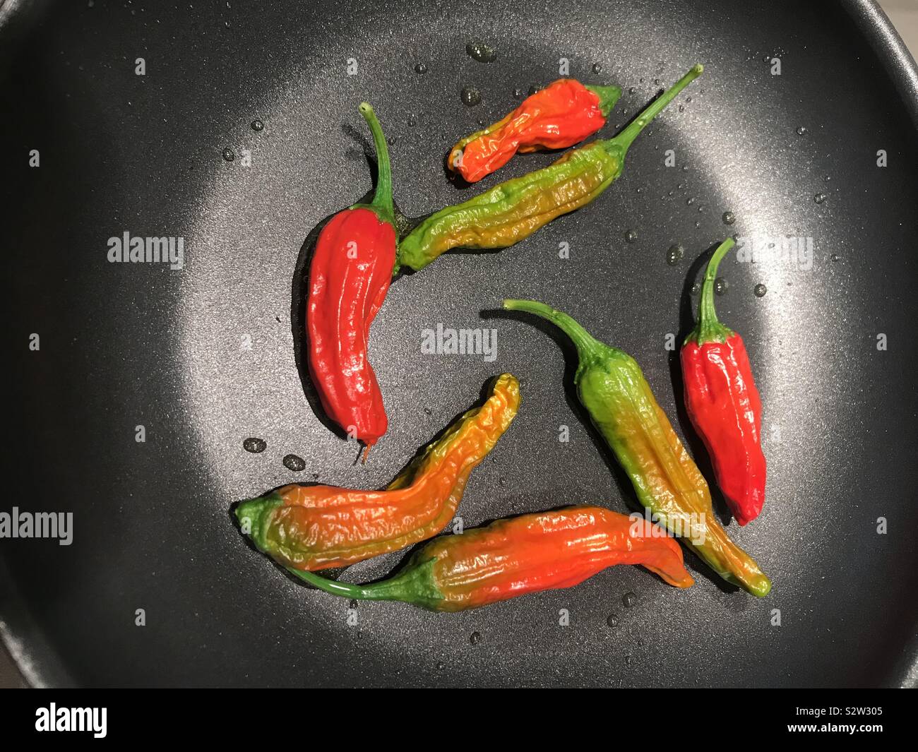 Chiles in a frying pan - Smartphone Captured Stock Image