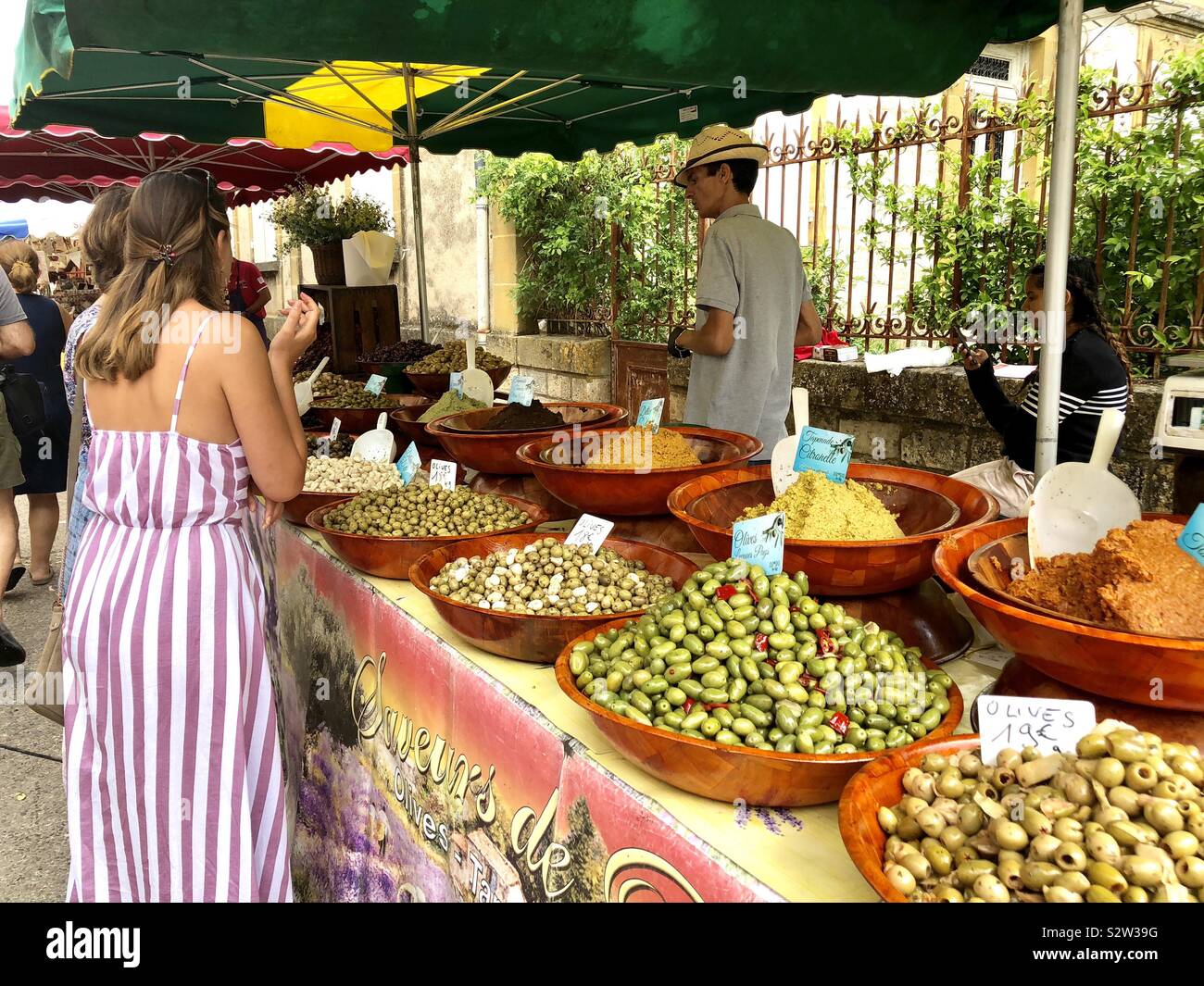 Street market stall selling olives in Monpazier in France - Smartphone Captured Stock Image